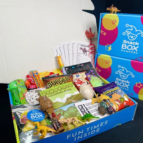 dinosaur gift hamper filled with dinosaur toys in a dinosaur box