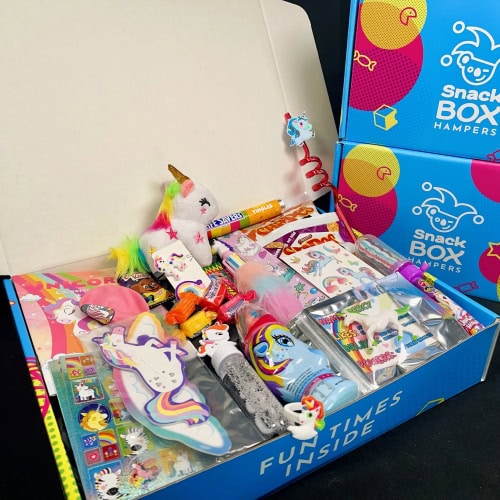 a unicorn gift hamper filled with unicorn toys inside a unicorn box