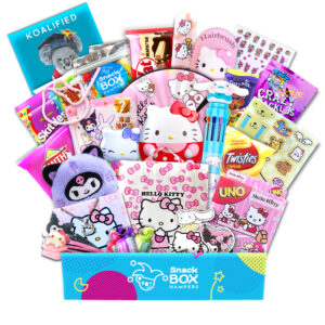a graduation gift hamper with hello kitty snacks and merch