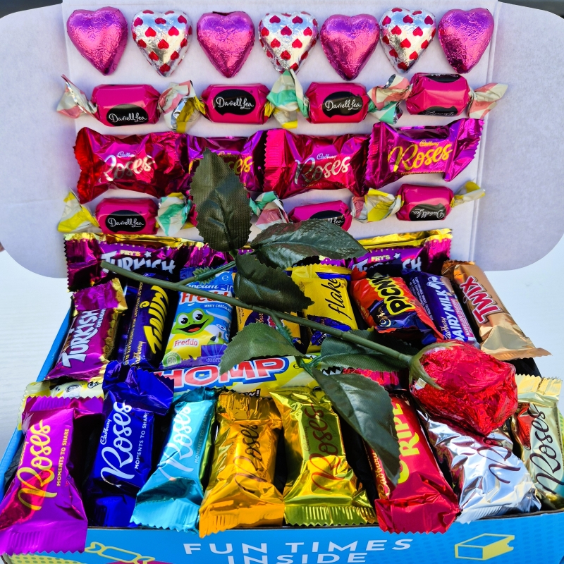 Valentine's Day gift basket filled with pink heart shaped chocolate