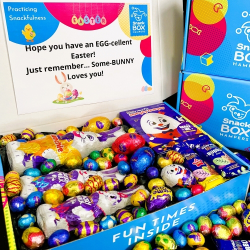 Easter gift hamper baskets filled with easter eggs and bunnies